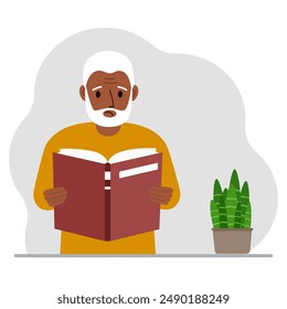 The man is holding a large book in his hands.