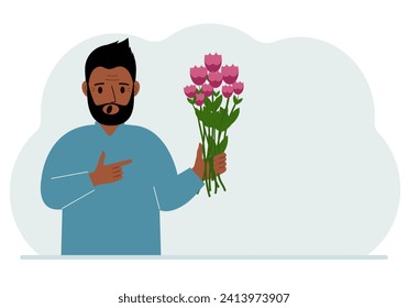 A man is holding a large bouquet of flowers. The concept of a holiday, congratulations, romance or gift.