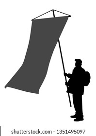 Man holding large vertical flag