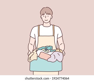  man holding laundry basket and detergent bottle. Hand drawn style vector design illustrations.