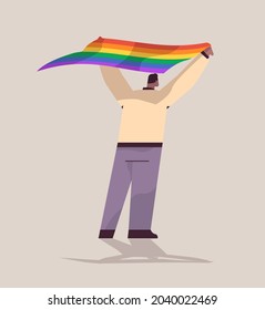 man holding lgbt rainbow flag gay lesbian love parade pride festival transgender love concept full length