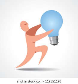 A man holding a light bulb. Its quite large compared to him, but he obviously wants to state he has a good idea.