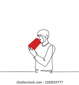 man holding and looking into a gift bag - one line drawing vector. concept to eat up snacks (peanuts and popcorn)