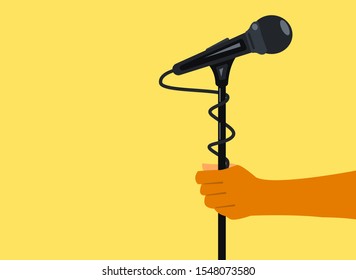 a man holding a mike stand by his hand for announcement 