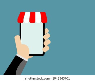 Man Holding Mobile Phone or Smartphone with blank Light Blue display and front store decoration on Blue Background with copy Space for Design,Banner,Marketing,Shopping Online.Vector Illustration.