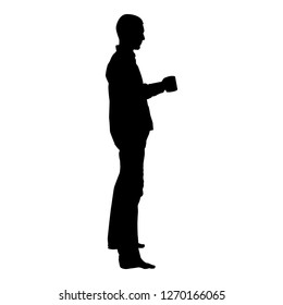 Man holding mug standing Concept of calm and home comfort