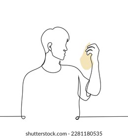 man holding package and reading composition or checking expiration date - one line drawing vector