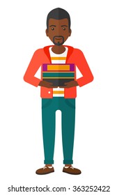 Man holding pile of books.