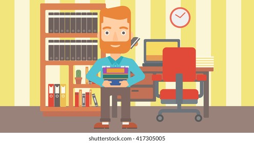 Man holding pile of books.