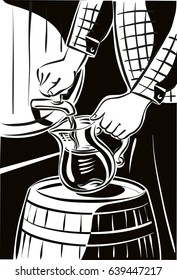 Man holding a pitcher is taking away, for a taste of the wine from a butt, in a cellar.
