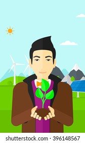 Hombre sujetando la planta.