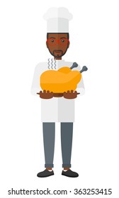 Man holding roasted chicken.