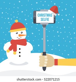 Man holding selfie monopod with smartphone in front of christmas winter background with snowman. Flat design vector illustration.