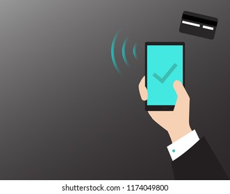 Man holding smart phone in hand and entering security code from credit card  using keyboard, online shopping concept on black background. Success, approved check mark aquamarine