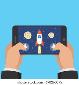 Man holding smartphone and playing in rocket game. Mobile gaming concept. Flat cartoon style. Vector illustration.