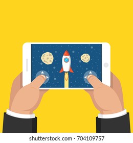 Man holding smartphone and playing in rocket game. Mobile gaming concept. Flat cartoon style. Vector illustration.