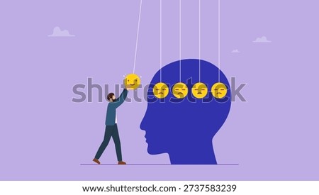 Man holding smile face pendulum ball to hit other sad faces. Optimistic, happiness or positive thinking inspire other people happy, emotional intelligence or balance between happiness and sadness.