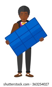 Man holding solar panel.