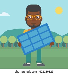Man holding solar panel.