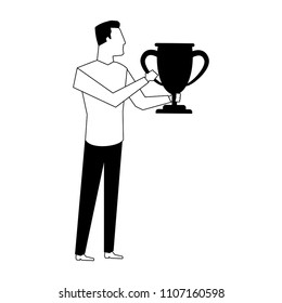 Man holding trophy cup in black and white