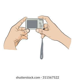 Man holding in two hands digital camera   and pushing button