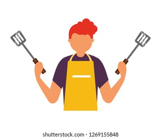 man holding two spatulas utensils