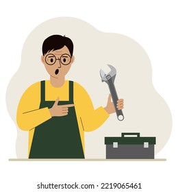 Ein Mann hält einen verstellbaren Schlüssel in der Hand und eine Werkzeugkasten daneben. Das Konzept der technischen Reparatur oder Dienstleistung. Flaches design, Vektorgrafik.