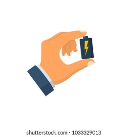 Man holds battery in hand. Vector illustration flat design. Isolated on white background. Battery clouseup.