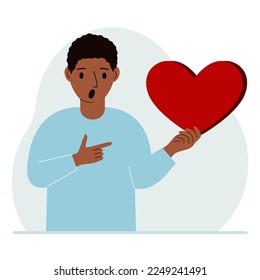A man holds a big red heart in his hand. The concept of volunteering, romantic relationship or love. Vector flat illustration.
