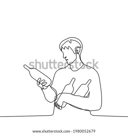 man holds bottles in his hands while reading the inscription on one of them - one line drawing vector. alcohol bulk shopping concept, scrupulous wine lover shopping