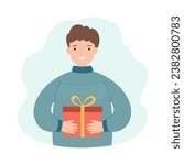 A man holds a Christmas present. Concept for winter holidays.