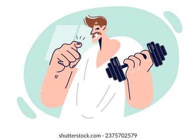 Man holds dumbbell for playing sports and points finger at screen, offering to visit gym together. Guy does fitness and uses sports equipment to pump up biceps and get muscular body