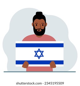 A man holds the flag of Israel in his hands. The concept of demonstration, national holiday or patriotism. Nationality.