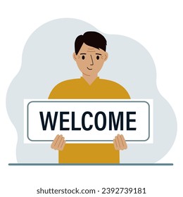 A man holds in his hands a large sign, banner, postcard with the text Welcome.