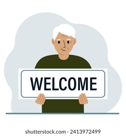 A man holds in his hands a large sign, banner, postcard with the text Welcome.