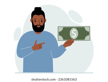 A man holds a large paper bill in his hand. The concept of income, expense, earning or spending money.