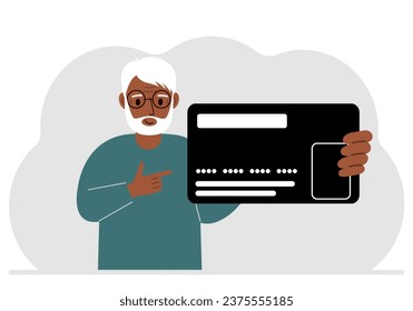 A man holds a large plastic credit card in his hand.