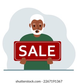 A man holds a large sign with the text SALE in his hands.