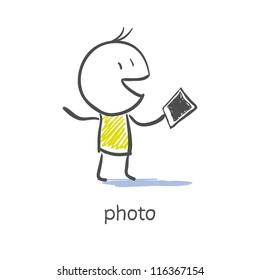 man holds  photo