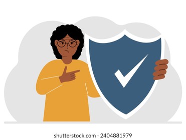 A man holds a shield in his hand, a symbol of insurance. Vector