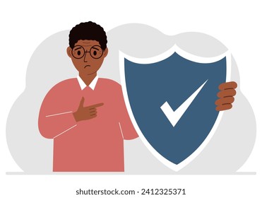 A man holds a shield in his hand, a symbol of insurance. Vector