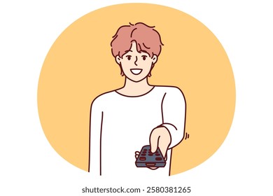 Man holds television remote control switches cable TV channels and smile, choosing interesting show for evening viewing. Happy guy pointing remote at screen wanting to turn off TV box