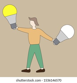 A man holds two light bulbs in his hands