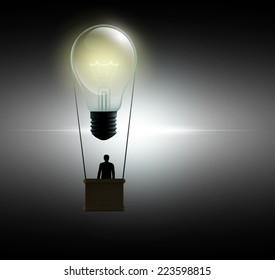 man in a hot air balloon in the form of an incandescent lamp - Shutterstock ID 223598815
