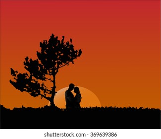 man hugging his beloved woman at sunset in a field near a tree.