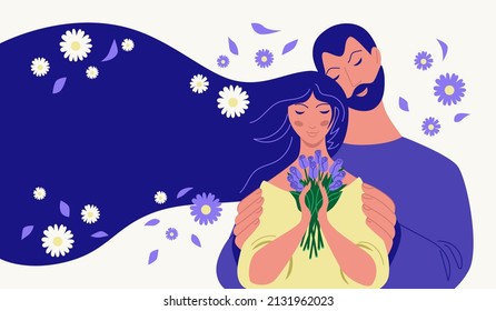 Man hugging a woman with a bouquet of flowers