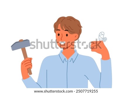Man injured finger using hammer to drive nail, shows thumbs up and reports that everything is OK. Young guy has finger injury with bandages applied to stop bleeding and avoid infection