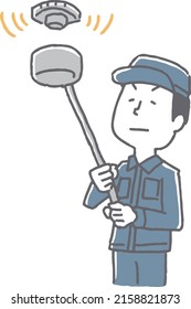 A man inspecting a sprinkler