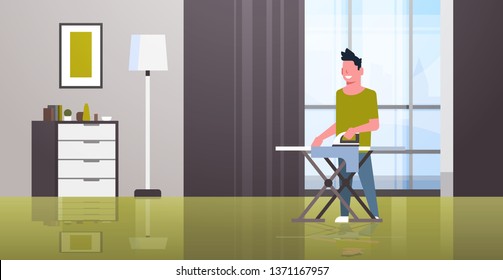 man ironing clothes guy holding iron doing housework housekeeping concept modern house living room interior male cartoon character full length flat horizontal