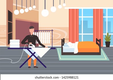 man ironing clothes guy using iron doing housework concept modern bedroom interior male cartoon character full length flat horizontal